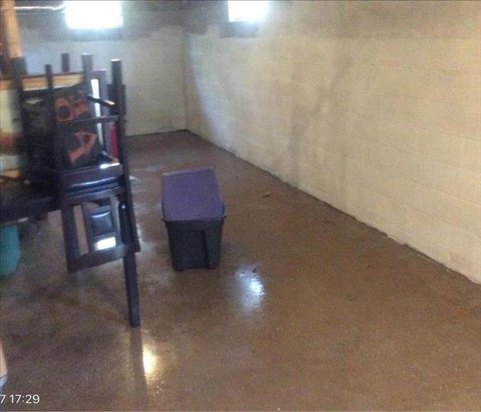 Basement with some contents on the floor