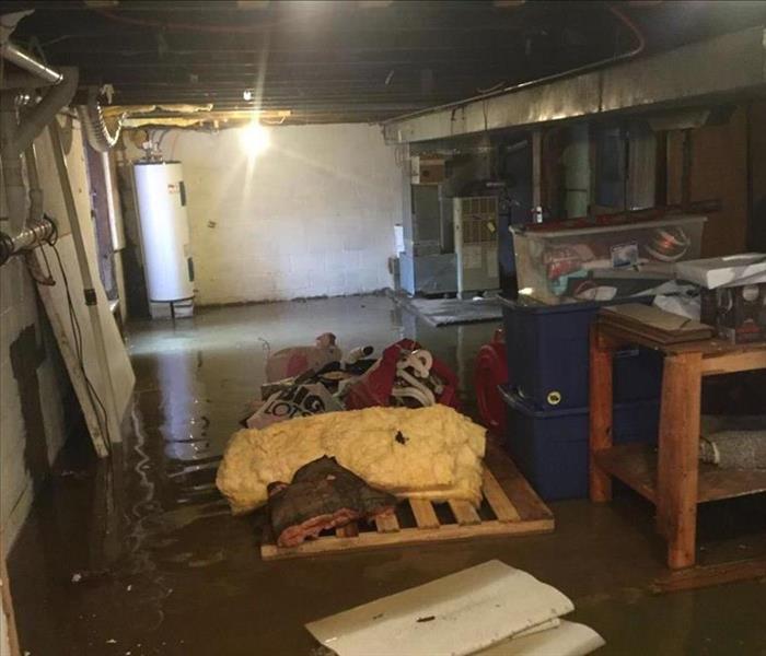 Basement with contents floating in inches of water